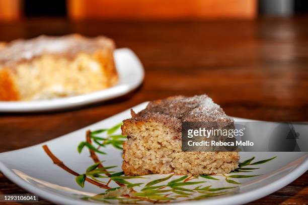 slice of apple cake with cinnamon and sugar on top - apple cake stock pictures, royalty-free photos & images