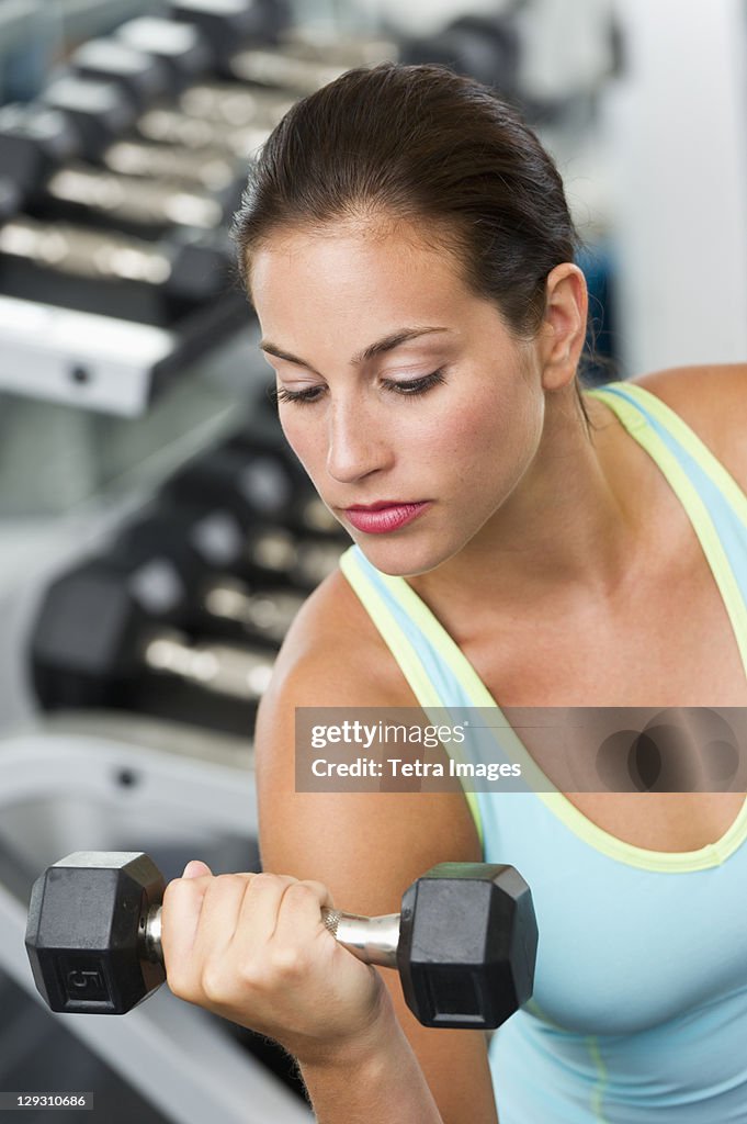 Woman exercising with dumbbells