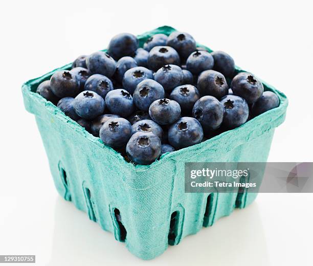 studio shot of blueberries - blueberry stock-fotos und bilder