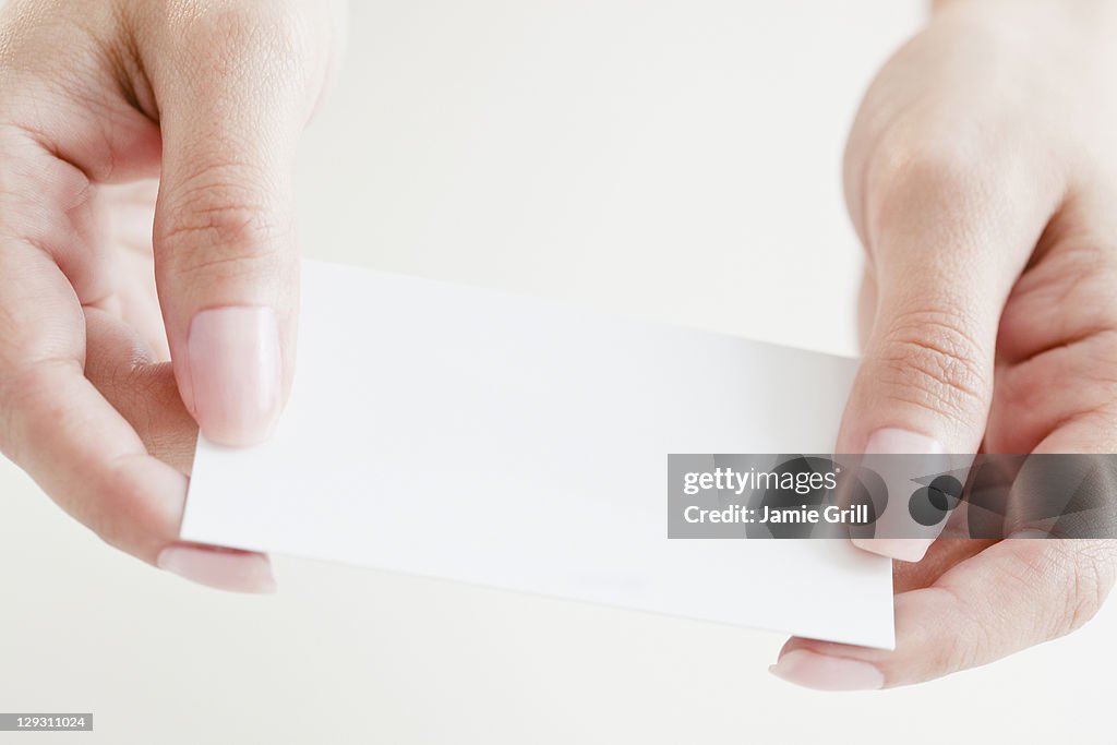 USA, New Jersey, Jersey City, Close up of woman's hands holding credit card