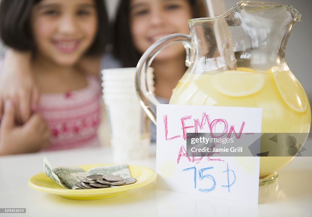 USA, New Jersey, Jersey City, Close up of two girl's (8-9, 10-11) selling lemonade