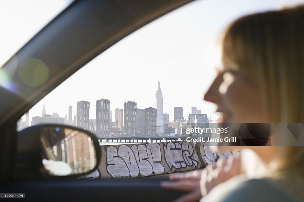 USA, Brooklyn, Williamsburg, Woman driving through city