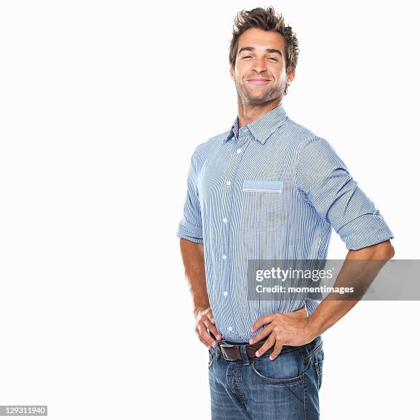 studio shot of young pride man with hands on hips - proud bildbanksfoton och bilder