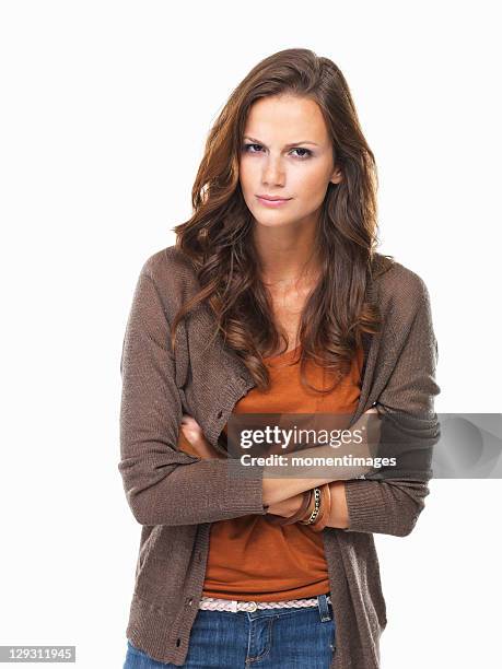 studio shot of young woman with crossed arms - confused woman stockfoto's en -beelden