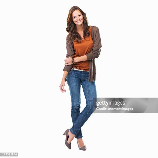 studio shot of young attractive woman standing on white background and smiling - confidence studio shot foto e immagini stock