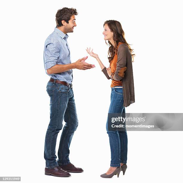 studio shot of young couple having conversation - face to face stock pictures, royalty-free photos & images