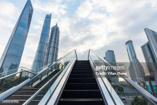 empty walk stairs by escalators in the city center - shanghai business stock-fotos und bilder
