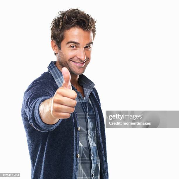 studio shot of young with thumbs up - thumbs up stockfoto's en -beelden