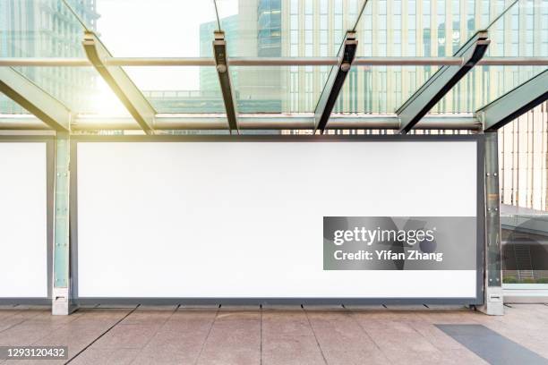 blank billboards on sidewalks in lujiazui financial district, pudong, shanghai at daytime - señal comercial fotografías e imágenes de stock