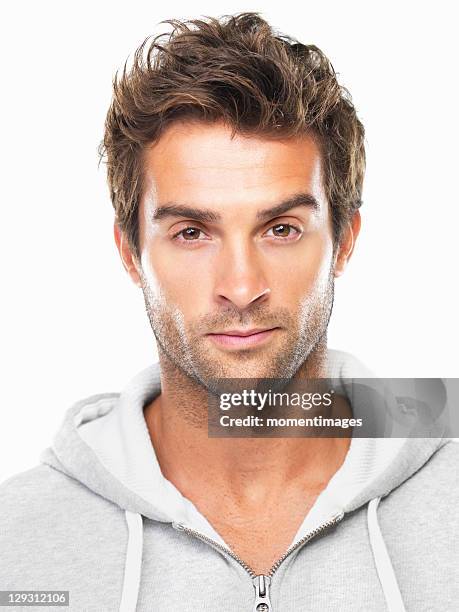 portrait of confident young man - spitzhaarfrisur stock-fotos und bilder