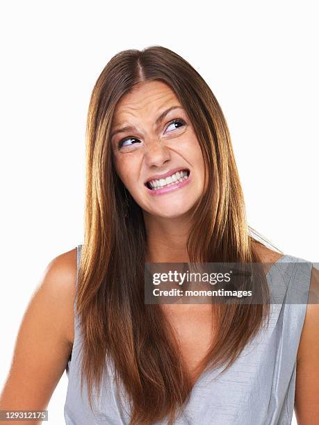 beautiful woman with fake smile looking away - cheesy grin stock pictures, royalty-free photos & images