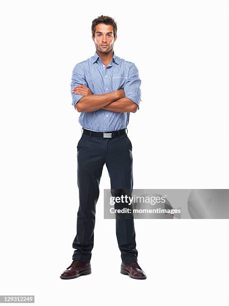 studio shot of confident business man standing with hands folded - young man in attitude stock pictures, royalty-free photos & images