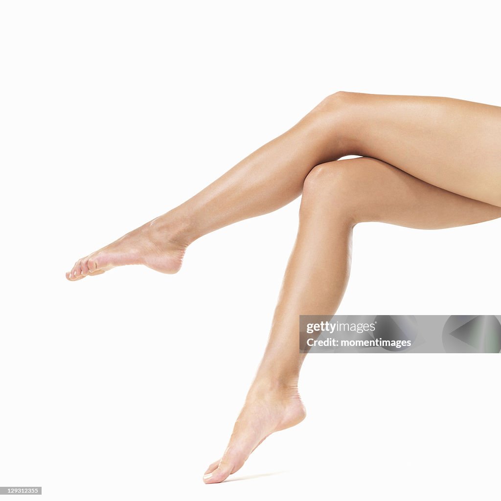 Studio shot of woman's barefoot legs