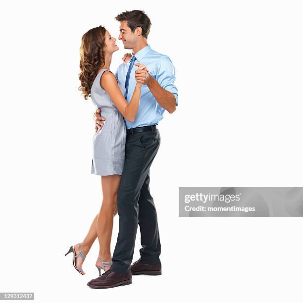 studio shot of happy couple dancing - romantic couple on white background stock-fotos und bilder