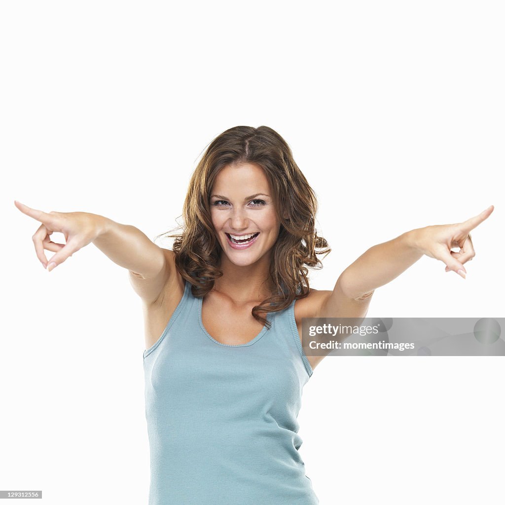 Studio portrait of attractive young woman at camera