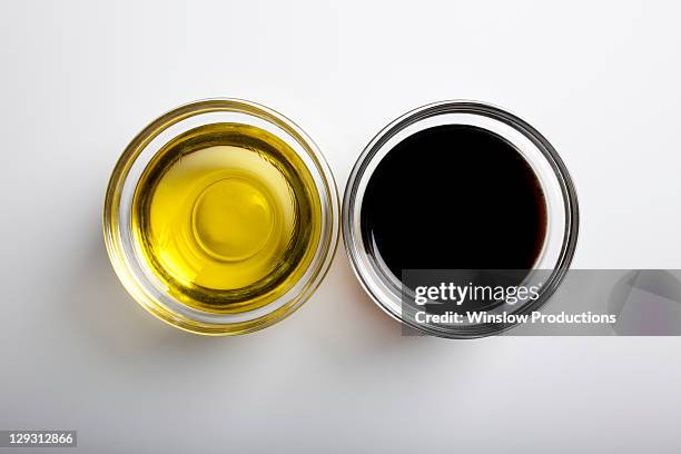 studio shot of olive and vinegar - vinegar stock-fotos und bilder