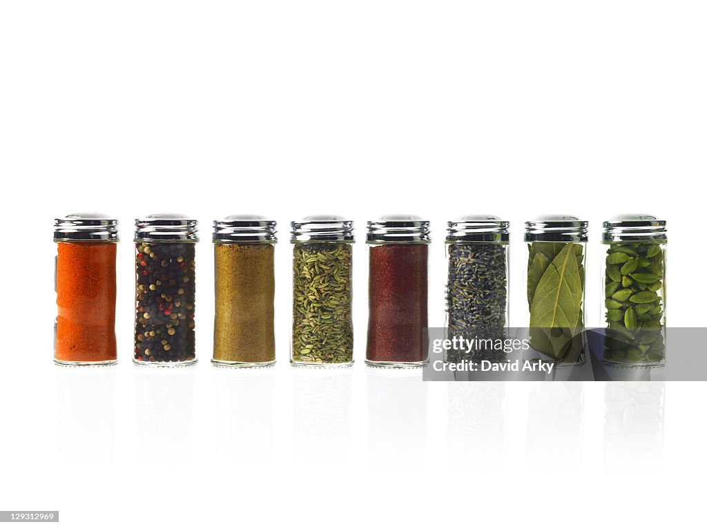 Studio shot of row of jars with spices