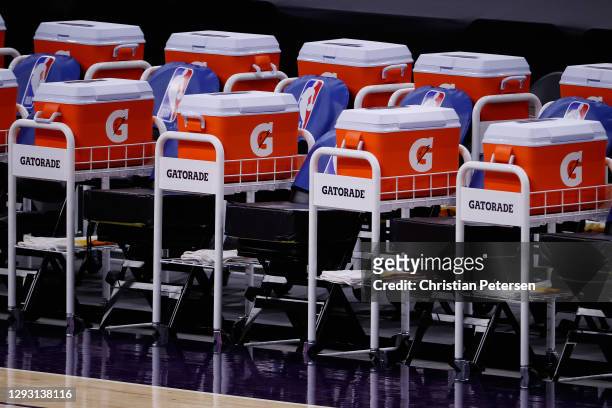 Detail of the bench area with Gatorade coolers between seats during the NBA game between the Phoenix Suns and the Dallas Mavericks at PHX Arena on...