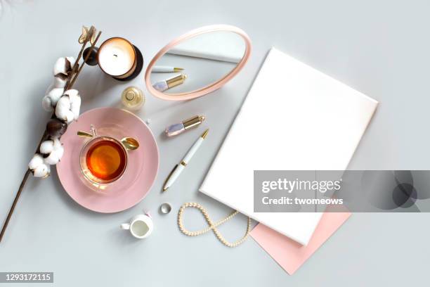 flat lay text spacepastel toned feminine stylised dressing table top with empty canvas still life. - vanity table stock pictures, royalty-free photos & images