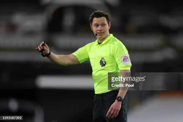 Referee Darren England reacts during the Premier League match between Fulham and Southampton at Craven Cottage on December 26, 2020 in London,...