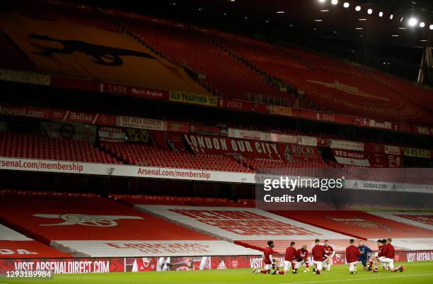 General view inside the stadium as Arsenal players warm up prior to the Premier League match between Arsenal and Chelsea at Emirates Stadium on...