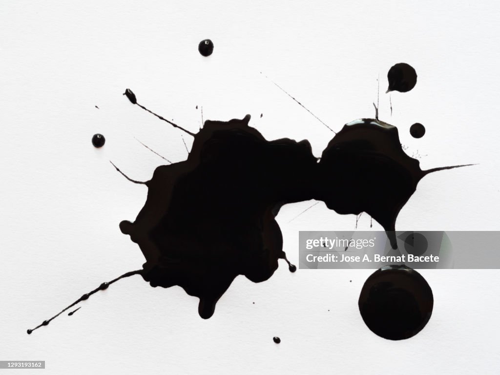 Abstract background, drops of black paint on a white canvas.