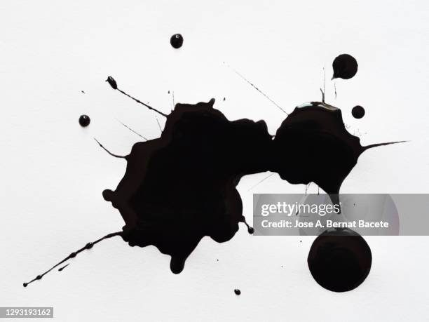 abstract background, drops of black paint on a white canvas. - ink photos et images de collection