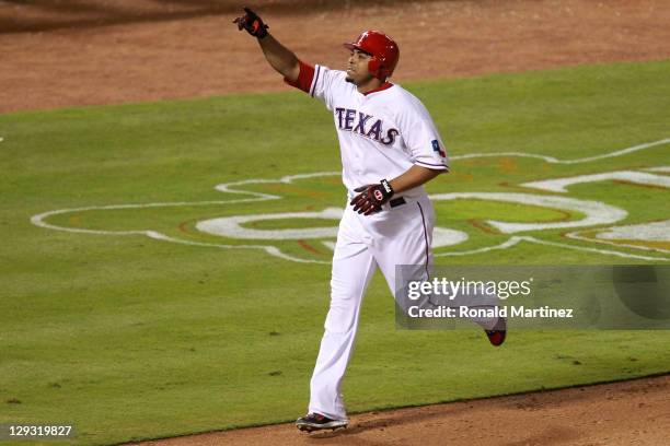 Nelson Cruz of the Texas Rangers celebrates after hitting a two-run home run in the seventh inning of Game Six of the American League Championship...