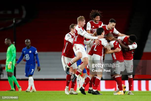 Granit Xhaka of Arsenal celebrates with teammates Rob Holding, Emile Smith Rowe, Mohamed Elneny, Hector Bellerin, Gabriel Martinelli, Alexandre...