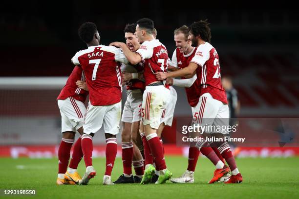 Granit Xhaka of Arsenal celebrates with teammates Bukayo Saka, Hector Bellerin, Gabriel Martinelli, Rob Holding and Mohamed Elneny after scoring...