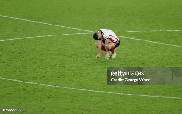 John Egan of Sheffield United looks dejected following their sides defeat in the Premier League match between Sheffield United and Everton at Bramall...