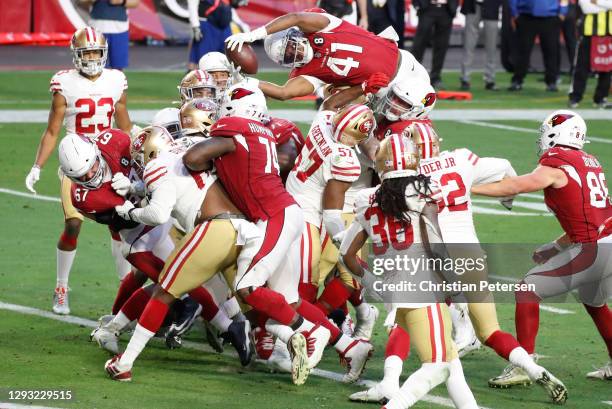 Running back Kenyan Drake of the Arizona Cardinals dives into the end zone for a touchdown during the second half against the San Francisco 49ers at...