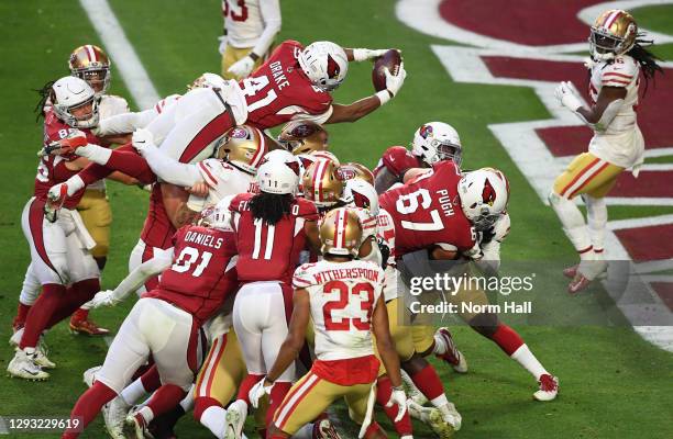 Running back Kenyan Drake of the Arizona Cardinals dives into the end zone for a touchdown during the second half against the San Francisco 49ers at...