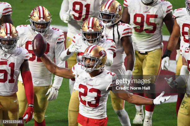 Cornerback Ahkello Witherspoon of the San Francisco 49ers celebrates with teammates after intercepting the ball in the end zone during the second...