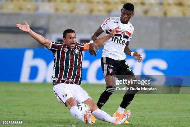 Fred of Fluminense struggles for the ball with Arboleda of Sao Paulo during a match between Fluminense and Sao Paulo as part of 2020 Brasileirao...