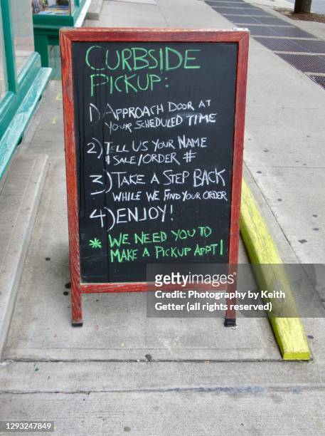 a re-opening business’ a-frame chalkboard sign - aufsteller stock-fotos und bilder