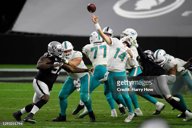 Arden Key of the Las Vegas Raiders is penalized for a face mask against Ryan Fitzpatrick of the Miami Dolphins during the fourth quarter of a game at...