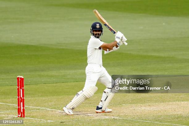 Ajinkya Rahane of India hits a four to bring up his century during day two of the Second Test match between Australia and India at Melbourne Cricket...