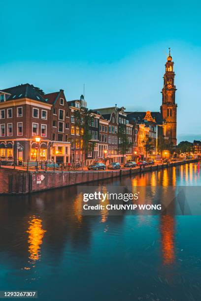 canal and traditional buildings in amsterdam - amsterdam stock pictures, royalty-free photos & images