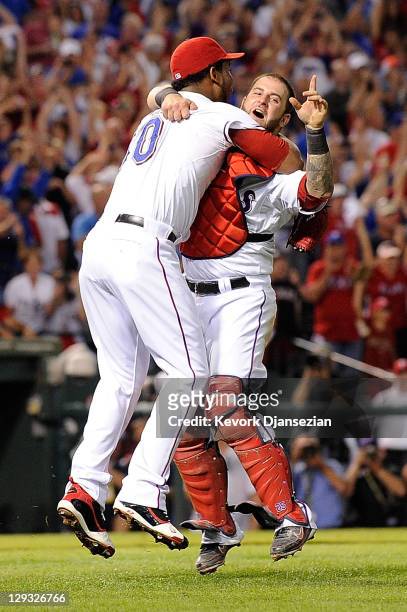 Neftali Feliz and Mike Napoli of the Texas Rangers celebrate winning Game Six of the American League Championship Series 15-5 against the Detroit...