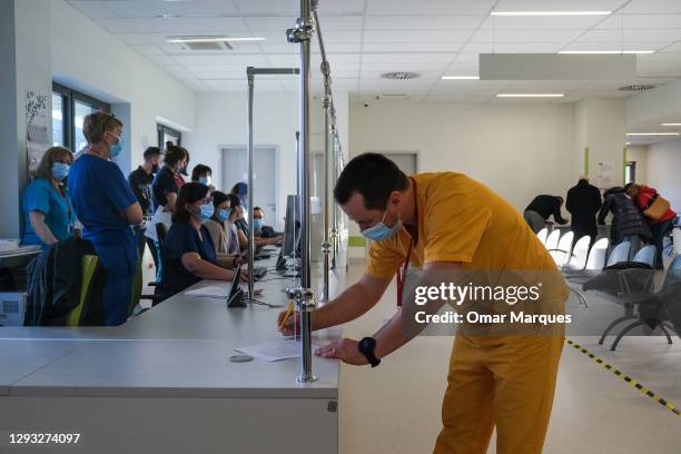 Health workers wait to be given the first jab of Pfizer BioNTech Covid-19 at Krakow University Hospital on December 27, 2020 in Krakow, Poland. On...