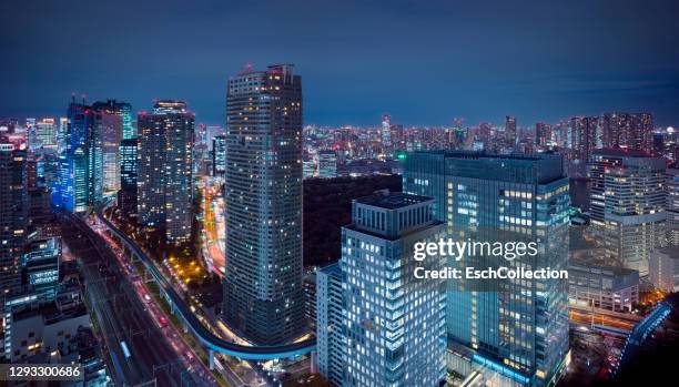 panoramic view from minato district towards chuo district in tokyo at dusk - headquarters stock pictures, royalty-free photos & images