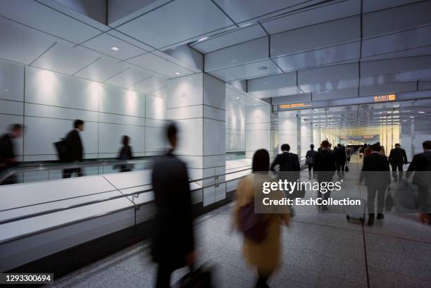 busy morning commute at metro underpass in tokyo, japan - underpass stock pictures, royalty-free photos & images