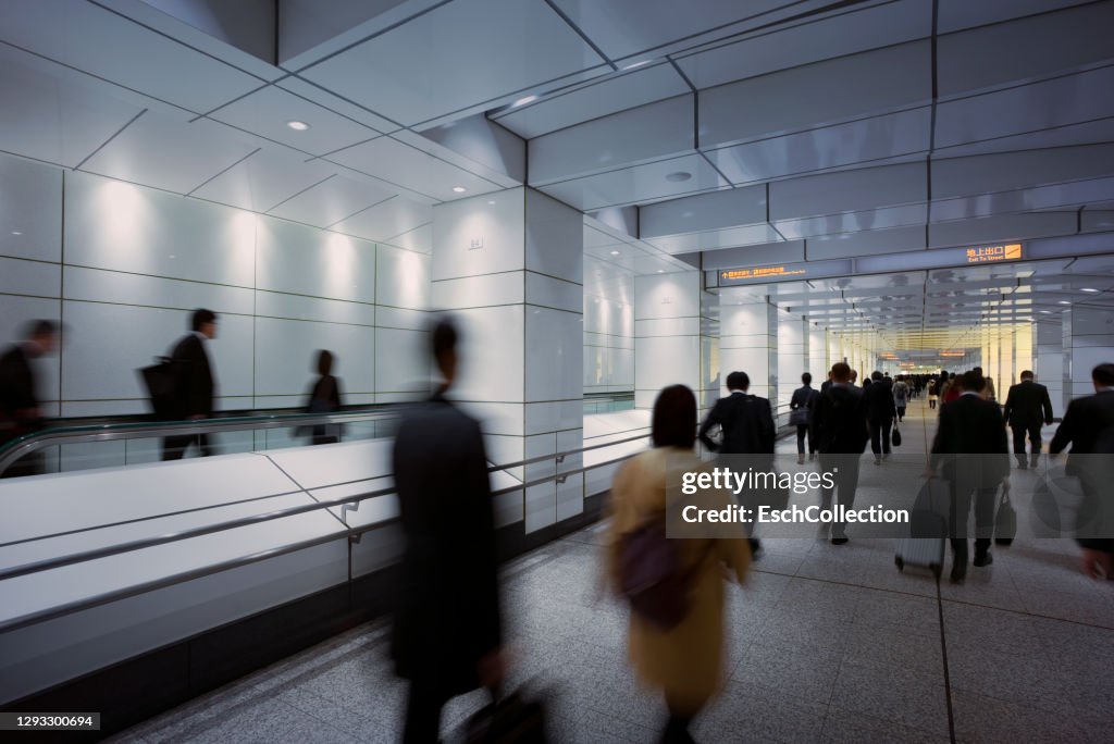 Busy morning commute at metro underpass in Tokyo, Japan