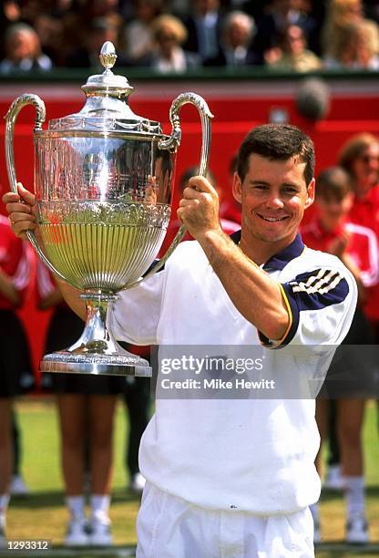 Scott Draper of Australia holds up the trophy after winning the 1998 Stella Artois Championships played at the Queen's Club, London, England. \...