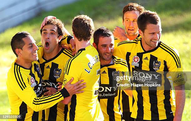 To R, Leo Bertos of the Phoenix congratulates teammate Daniel on his goal along with Tony Lochhead, Dani Sanchez, Nick Ward and Tim Brown during the...