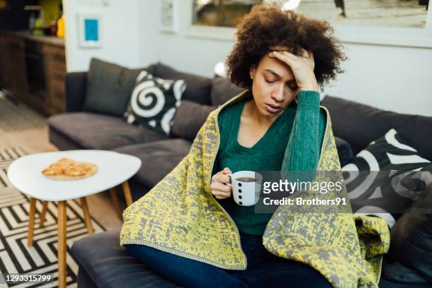 adult woman at home, feeling sick - symptom stock pictures, royalty-free photos & images