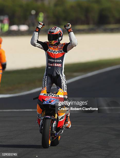Casey Stoner of Australia rider of the Repsol Honda Team Honda celebrates after winning the race and the championship at the Australian MotoGP, which...