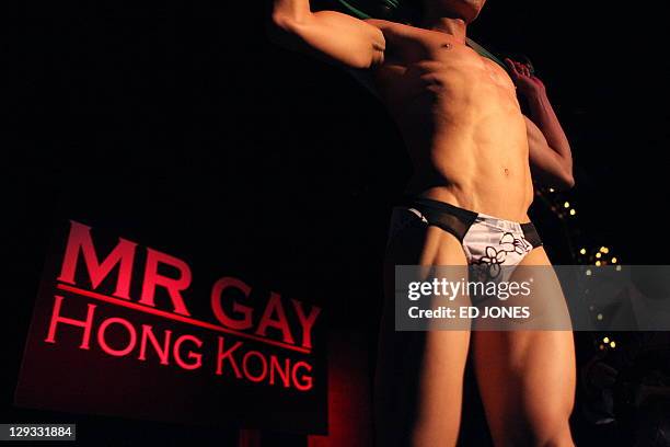 In a photo taken on October 15, 2011 'Mr. Gay Hong Kong 2011' winner Jimmy Wong Chun poses as he performs during the competition's final pageant at...