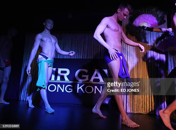 In a photo taken on October 15, 2011 'Mr. Gay Hong Kong 2011' winner Jimmy Wong Chun and contestant Jonathan Bridge Hudson perform during the...